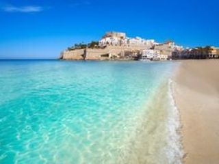 View of Peniscola Castle from the shore of the beach